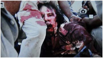 Muammar Gaddafi dragged through the streets